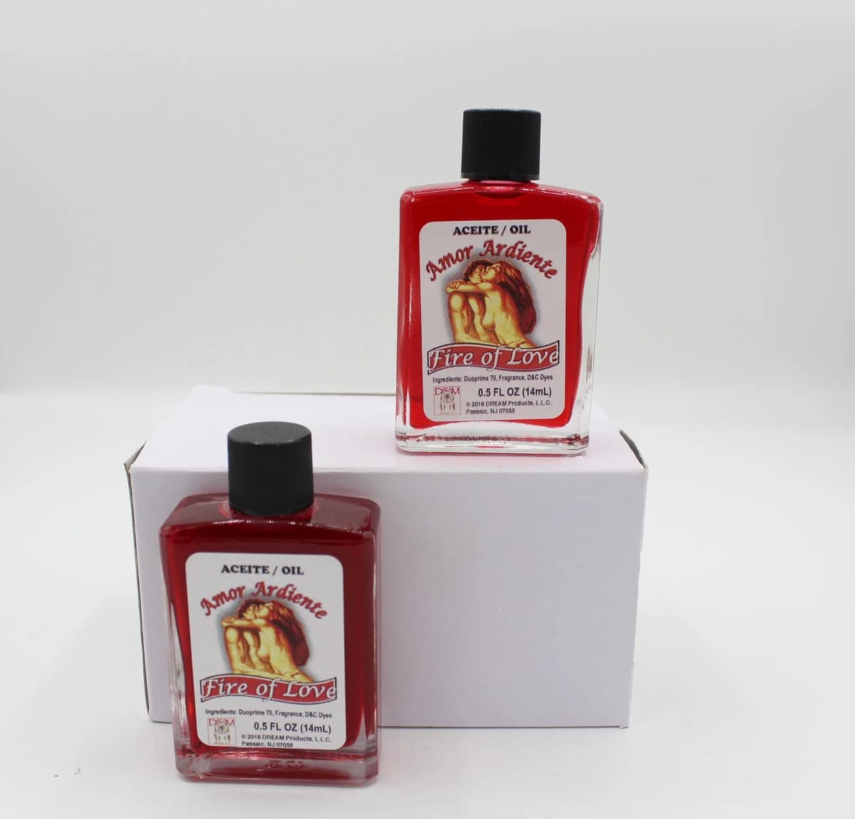 Frascos de aceite espiritual Amor Ardiente Fire of Love con etiqueta de pareja.